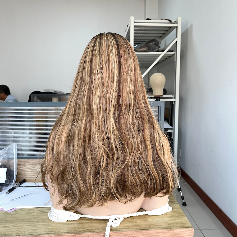 A natural warm brown with golden blonde highlights silk top wig
