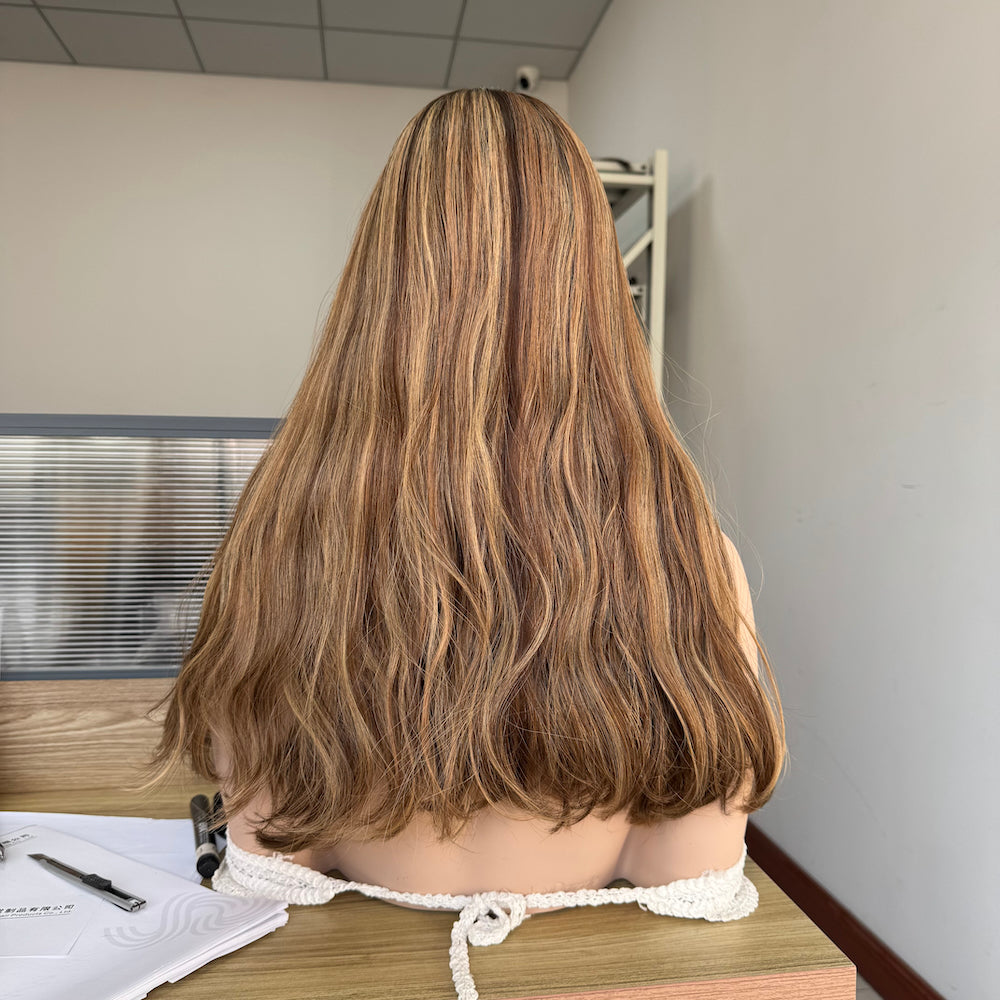 A natural warm brown with golden blonde highlights silk top wig