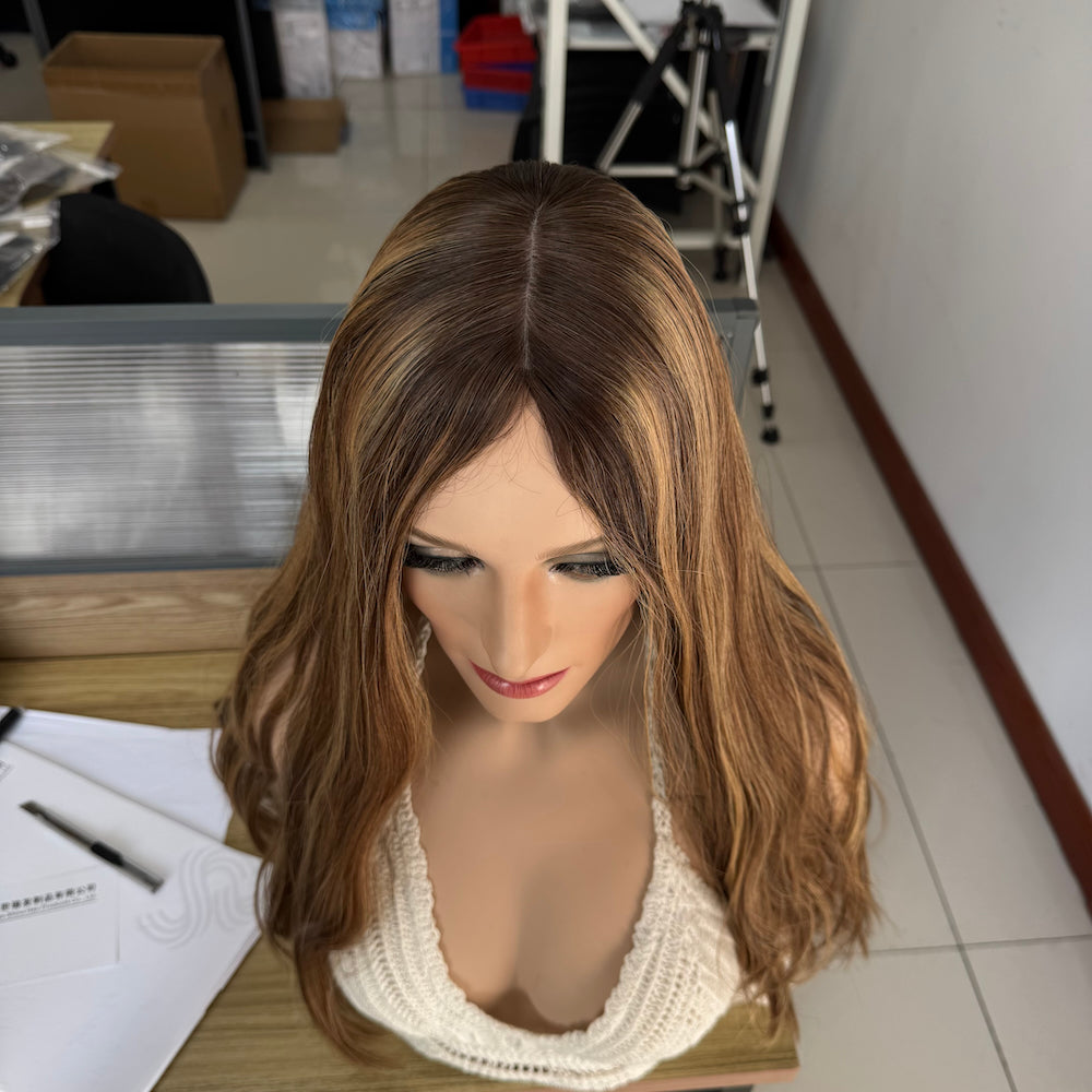 A natural warm brown with golden blonde highlights silk top wig